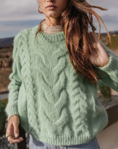 woman in a mint green sweater